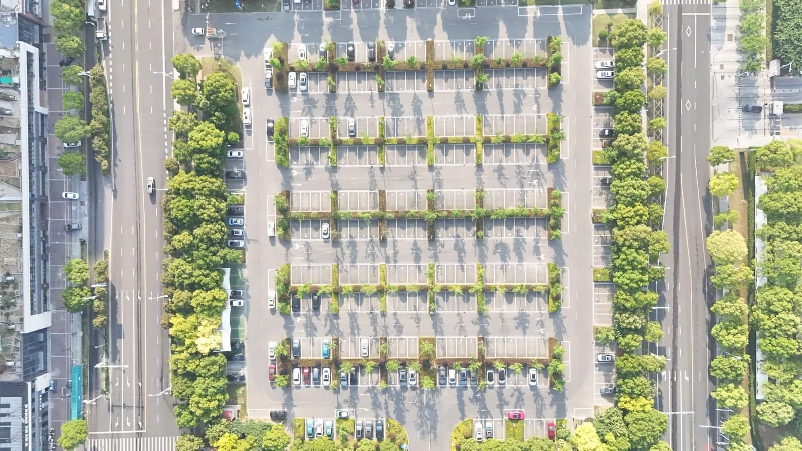 Aerial view of a large UK commercial car park — the kind of site a solar carport canopy turns into a generating asset